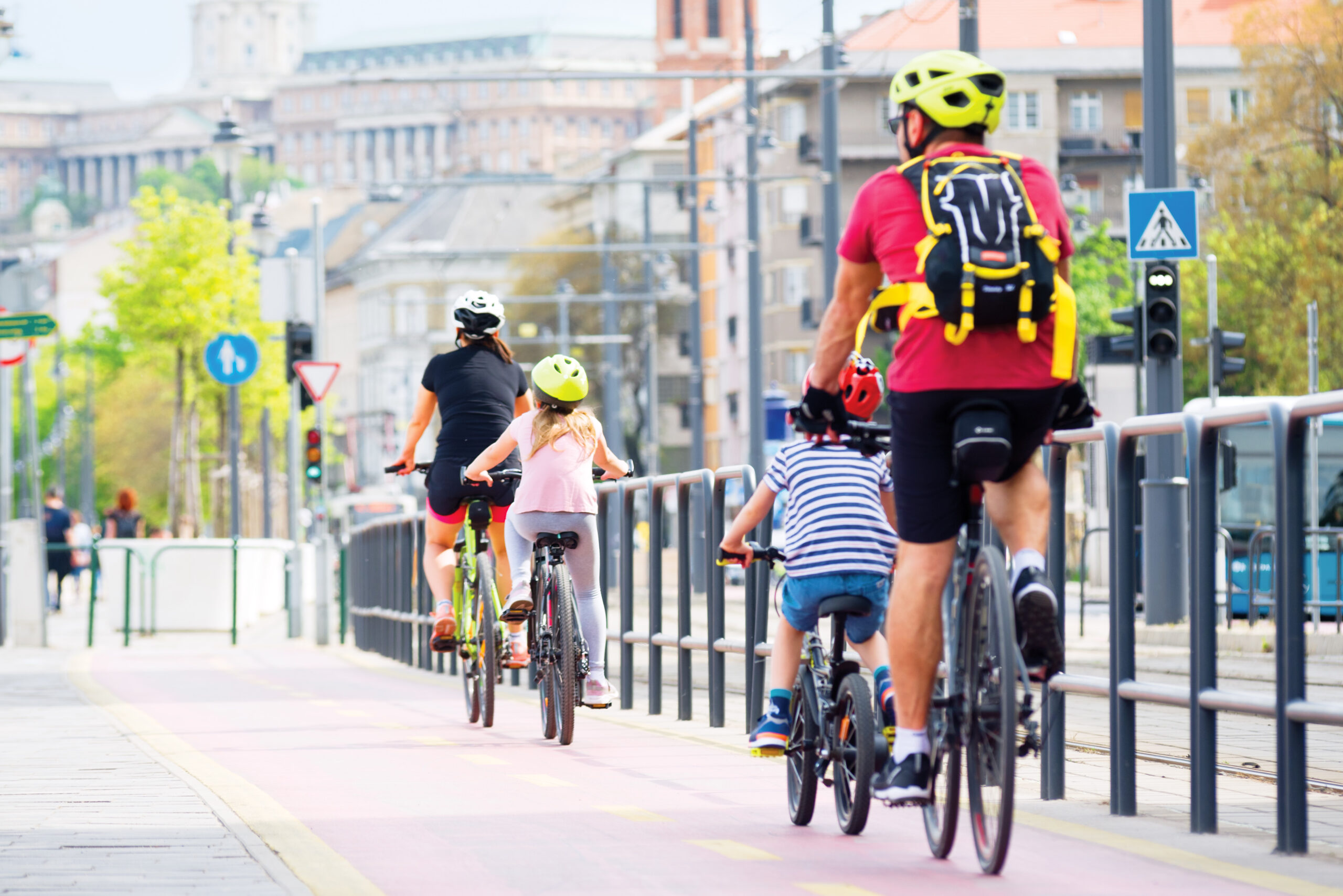 Family riding bikes in the city